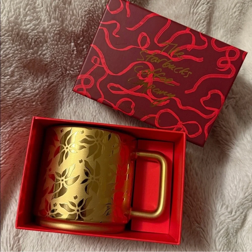 2025 Starbucks, gold poinsettia coffee cup. New with box.